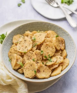 Tender smothered potatoes with caramelized onions and rich seasoning.